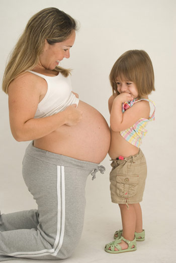 Mãe, barriga e filha